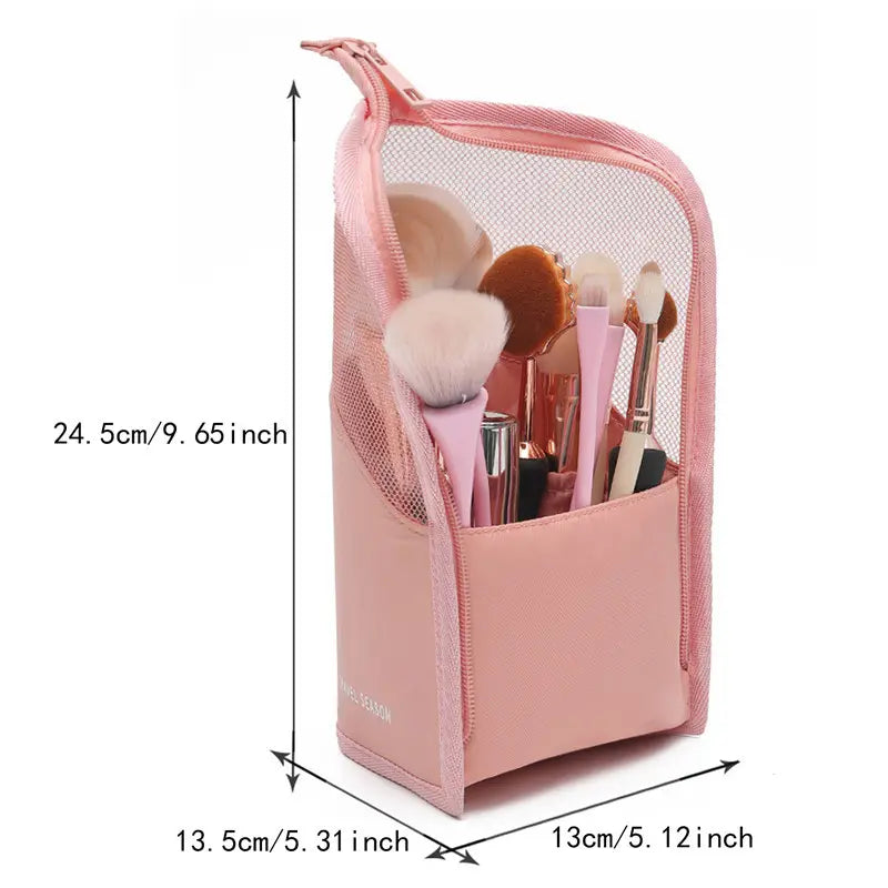 Pink cosmetic bag with makeup brushes and dimensions labeled