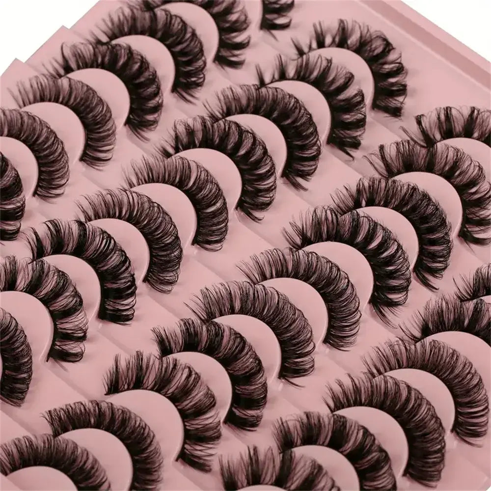 Multiple pairs of false eyelashes on a pink tray
