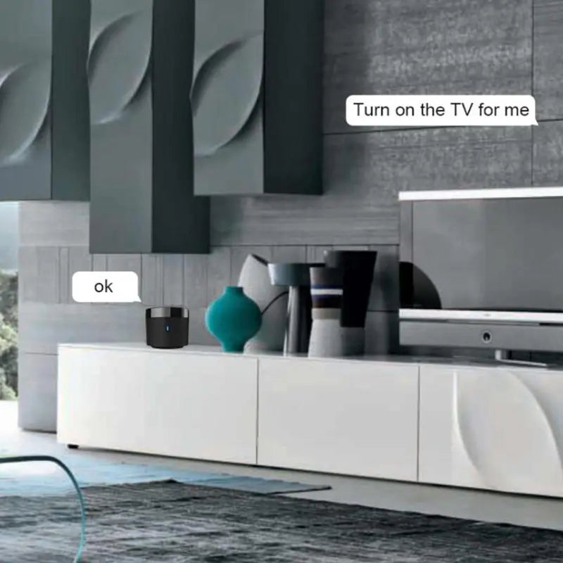 Modern living room with a TV and a control panel on a wall.