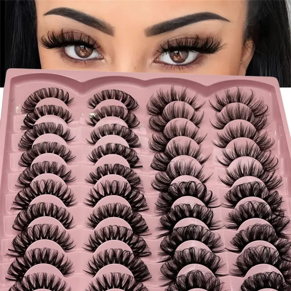 Set of false eyelashes displayed on a pink tray with a person wearing them.